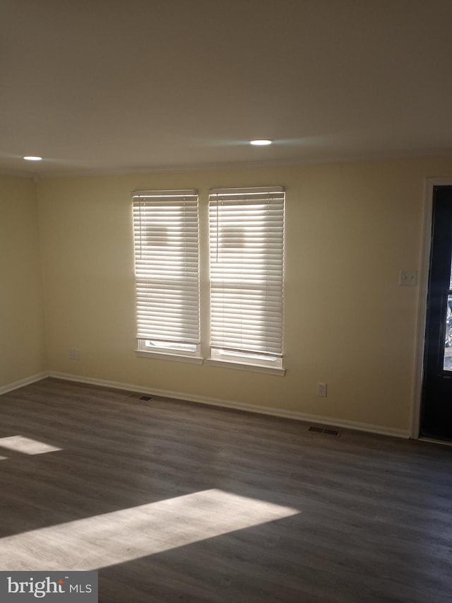 empty room featuring dark hardwood / wood-style floors