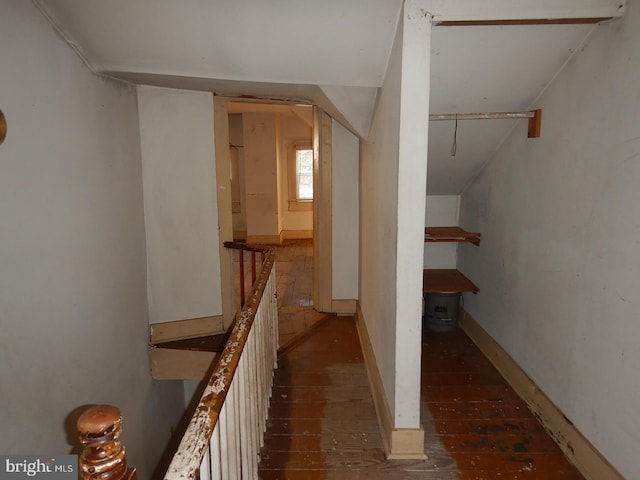 interior space featuring wood-type flooring and vaulted ceiling