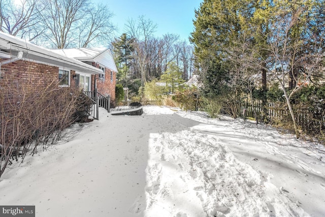 view of yard covered in snow