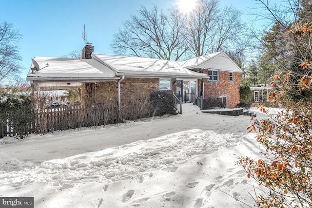 view of snow covered property