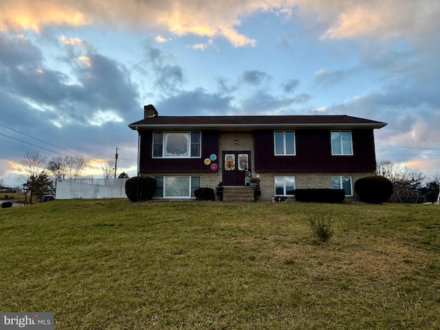 view of front of home with a lawn