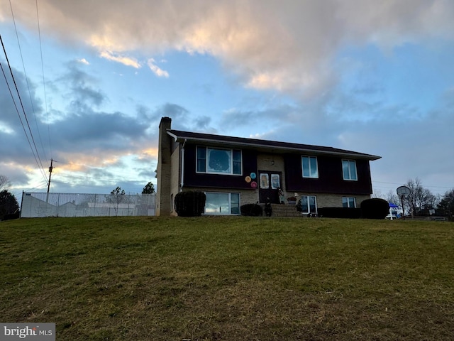 view of front of house with a lawn