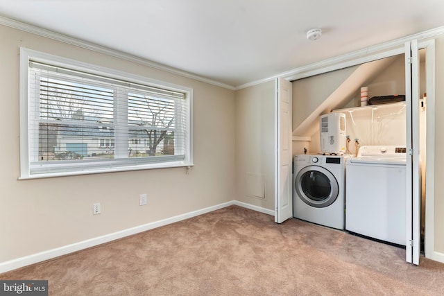 laundry area with independent washer and dryer, light colored carpet, and crown molding