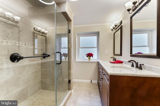 bathroom featuring tile patterned floors, vanity, ornamental molding, and walk in shower