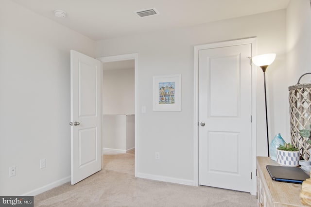 bedroom with light colored carpet