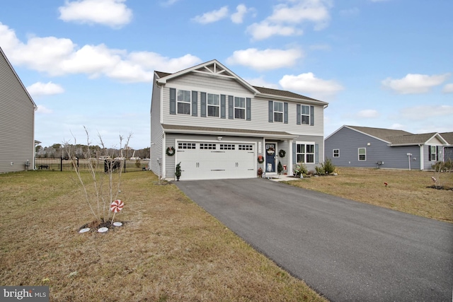 view of front facade with a front lawn and a garage