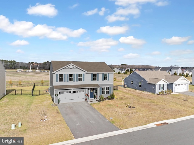 view of front facade with a front yard and a garage