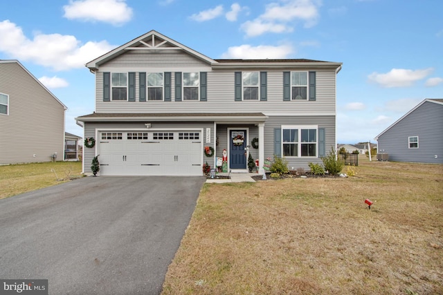 front of property with a garage and a front yard