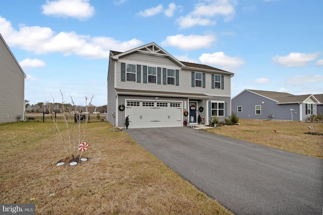 view of front facade featuring a garage and a front yard