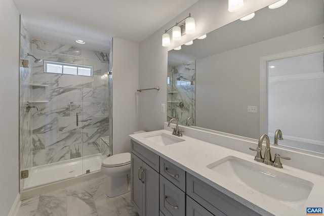 bathroom featuring a shower with door, vanity, and toilet