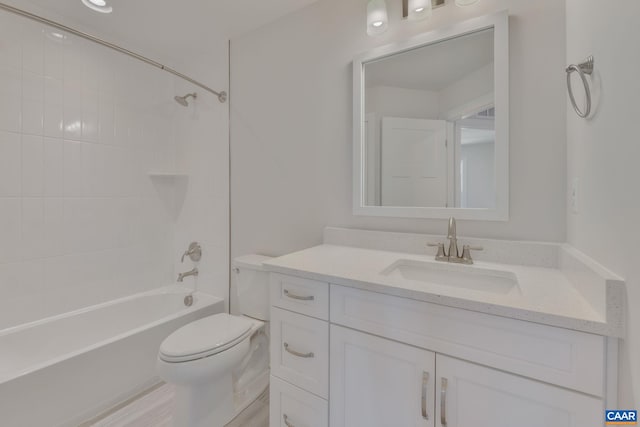 full bathroom with vanity, toilet, and tiled shower / bath