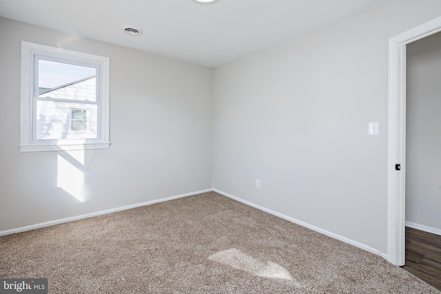 unfurnished room featuring carpet