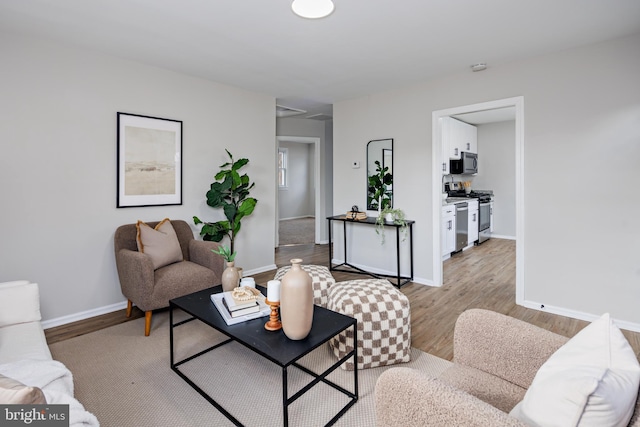 living room with light hardwood / wood-style floors