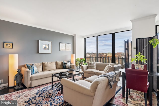 living room with hardwood / wood-style floors, a wall of windows, and crown molding