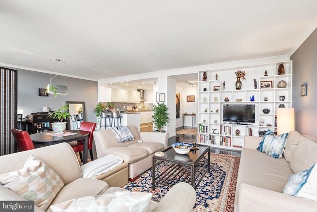 living room featuring crown molding