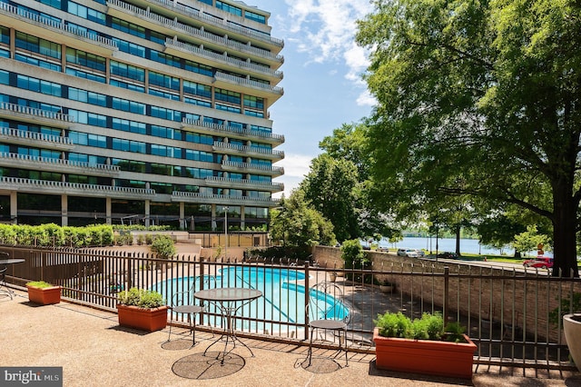 view of swimming pool with a patio area