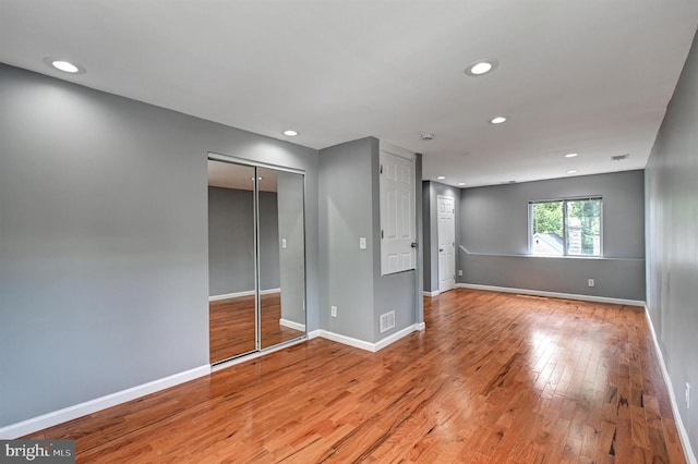 unfurnished bedroom featuring light wood-type flooring