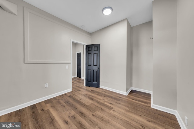 spare room featuring hardwood / wood-style flooring