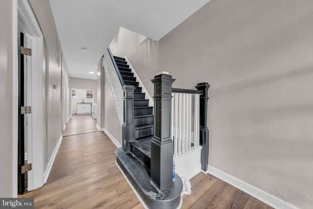 stairs with wood-type flooring