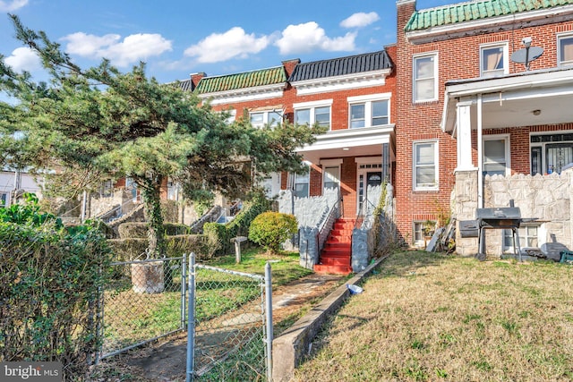 view of property with a front lawn