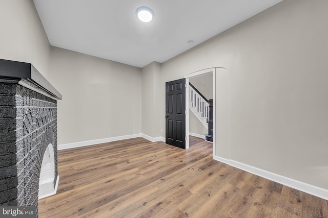 spare room with wood-type flooring