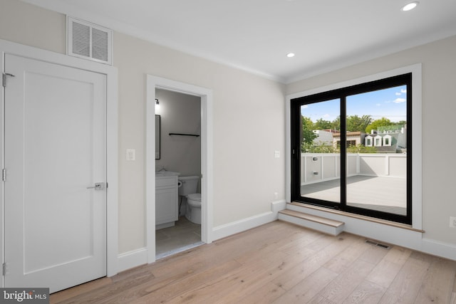 3710 S St NW, Washington, DC 20007 - unfurnished bedroom featuring light wood finished floors, baseboards, visible vents, and access to outside