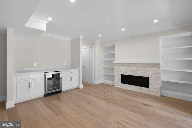 3710 S St NW, Washington, DC 20007 - bar featuring light wood-type flooring, built in features, a bar, beverage cooler, and ornamental molding