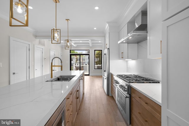 3710 S St NW, Washington, DC 20007 - kitchen featuring wall chimney exhaust hood, light wood finished floors, a sink, recessed lighting, and high end appliances