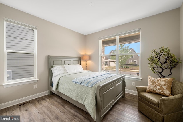 bedroom with wood-type flooring