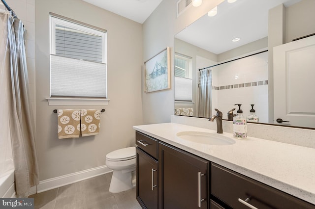 full bathroom featuring tile patterned floors, shower / bathtub combination with curtain, vanity, and toilet