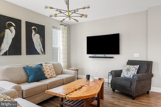 living room featuring hardwood / wood-style floors and an inviting chandelier