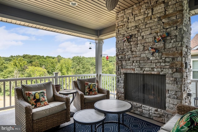 exterior space with an outdoor living space with a fireplace