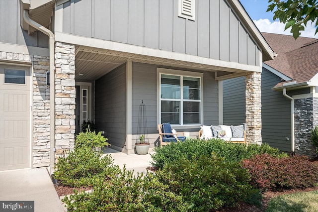 property entrance with a porch and a garage