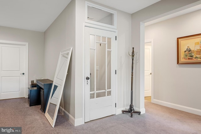 view of carpeted foyer