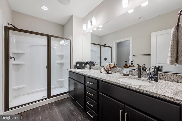 bathroom with vanity and an enclosed shower