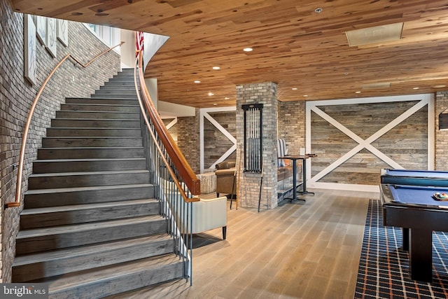 interior space with wood-type flooring and wooden ceiling