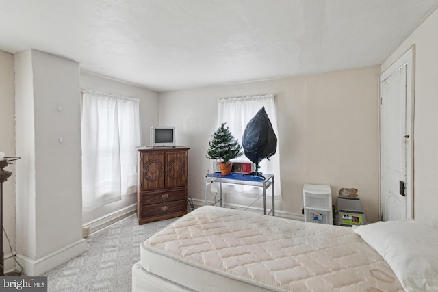 bedroom with multiple windows