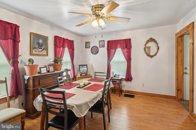 dining room featuring ceiling fan, light wood-type flooring, and plenty of natural light