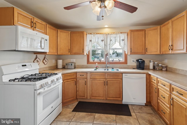 kitchen featuring sink, white appliances, ceiling fan, and light tile patterned floors