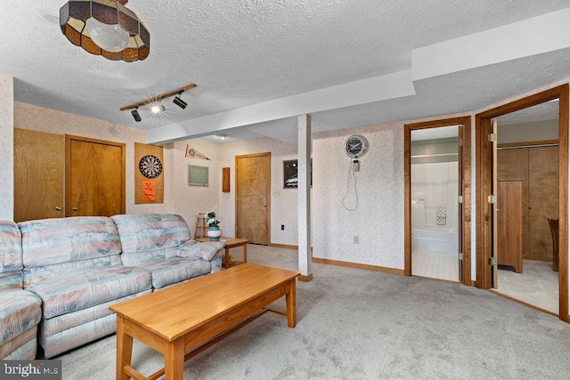 living room featuring light colored carpet and a textured ceiling