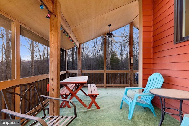 sunroom / solarium featuring ceiling fan, wood ceiling, and vaulted ceiling