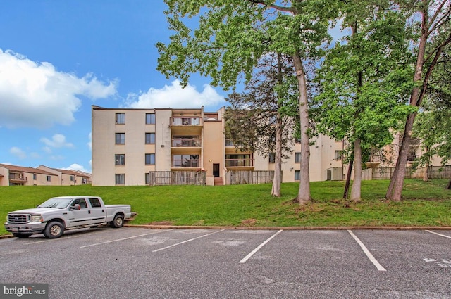 10137 Prince Pl Unit 203-6B, Upper Marlboro, MD 20774 - view of building exterior with uncovered parking