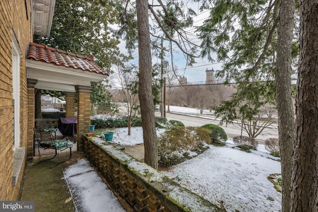 yard covered in snow with fence