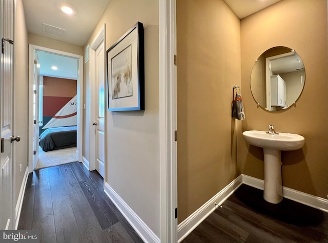 bathroom with hardwood / wood-style flooring