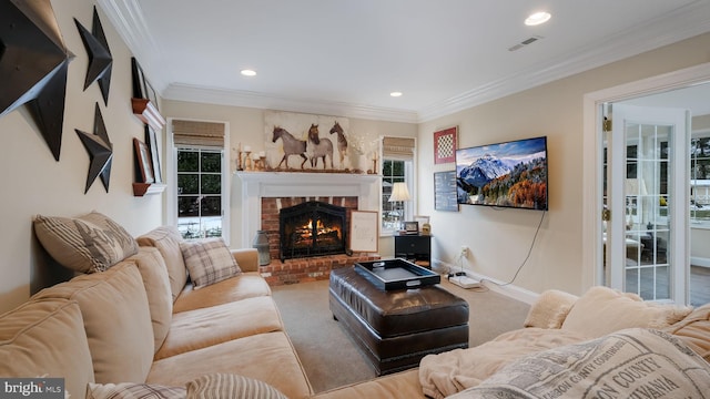 carpeted living room with a brick fireplace and crown molding