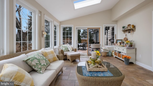 sunroom / solarium with lofted ceiling with skylight