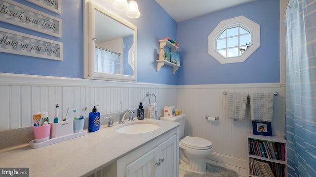 bathroom with toilet and vanity