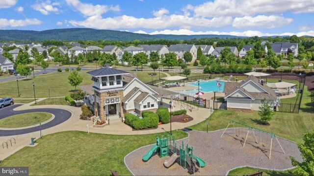 birds eye view of property featuring a mountain view