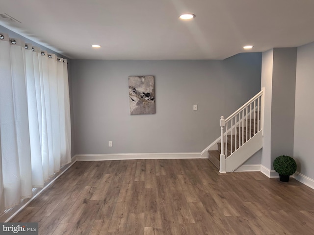 spare room featuring dark hardwood / wood-style flooring