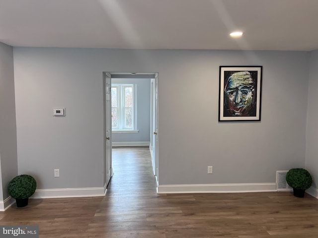 empty room featuring dark wood-type flooring